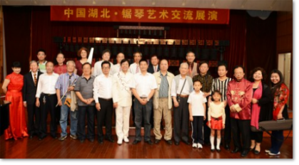 Katharina Micada with musical saw players after the concert in Wuhan/China